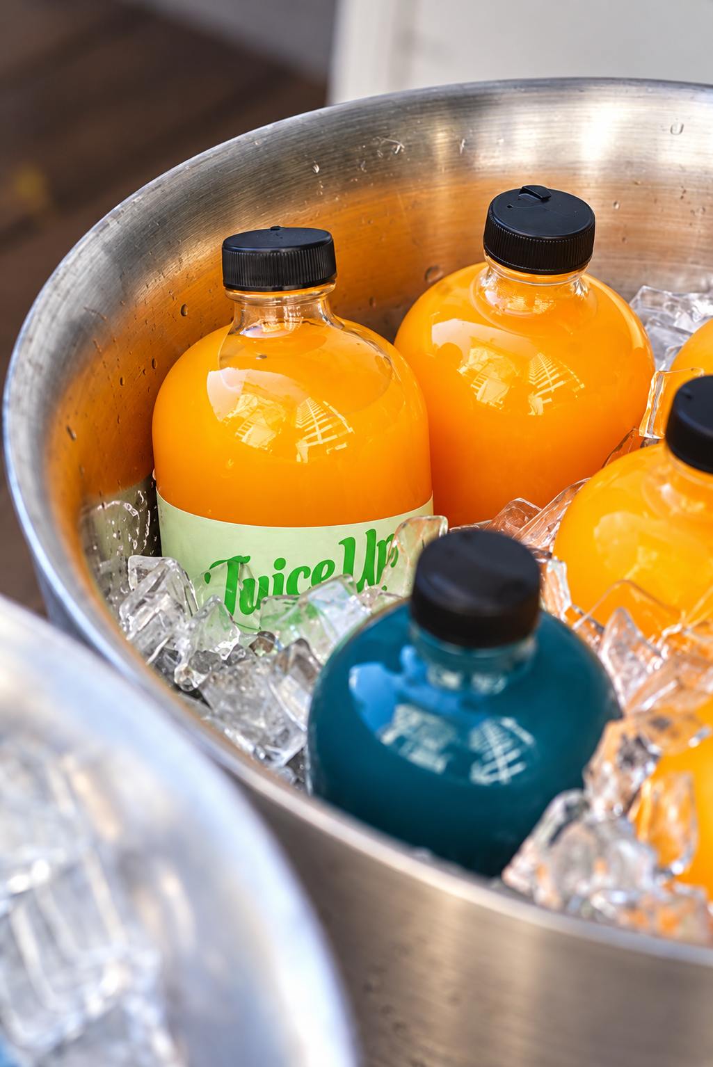 Juice Up bottles chilling in a bucket of ice